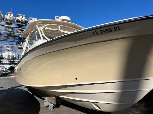 Slide: The Image of 2013 Grady-White Freedom 335 boat on display, showcasing sleek design and craftsmanship. - 10