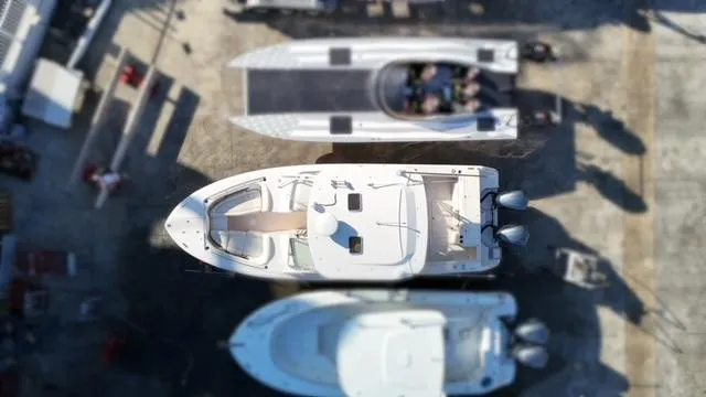 Slide: The Image of Aerial view of 2013 Grady-White Freedom 335 boat docked among other vessels. - 12