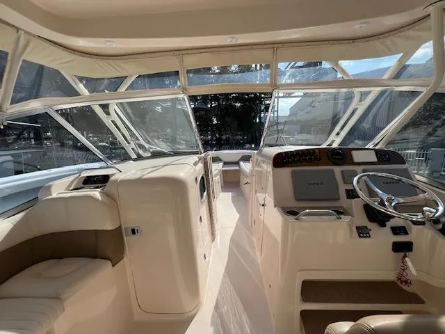 Slide: The Image of 2013 Grady-White Freedom 335 boat interior with helm and seating area. - 18