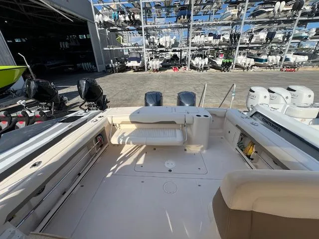 Slide: The Image of 2013 Grady-White Freedom 335 boat interior with docked vessels in background. - 19