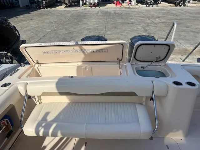 Slide: The Image of 2013 Grady-White Freedom 335 boat interior with seating and storage compartments. - 20
