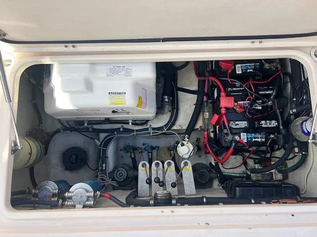 Slide: The Image of Engine compartment of 2013 Grady-White Freedom 335 boat, showing wiring and components. - 25