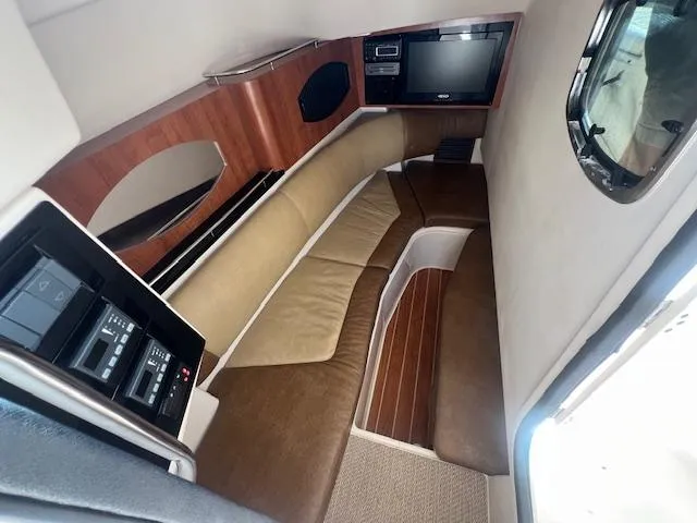 Slide: The Image of Interior of 2013 Grady-White Freedom 335 boat with seating and entertainment system. - 28