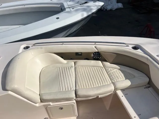 Slide: The Image of 2013 Grady-White Freedom 335 boat interior with cushioned seating area. - 38