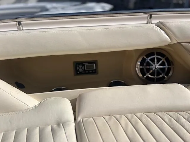 Slide: The Image of 2013 Grady-White Freedom 335 boat interior with beige seating and speaker system. - 41