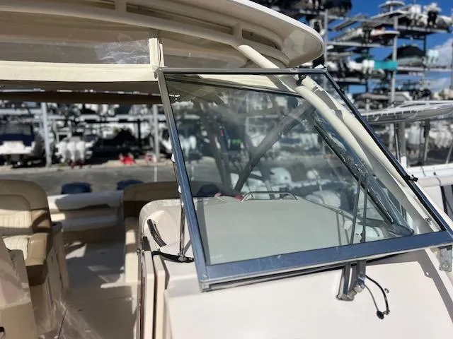Slide: The Image of 2013 Grady-White Freedom 335 boat windshield and interior view at marina. - 42