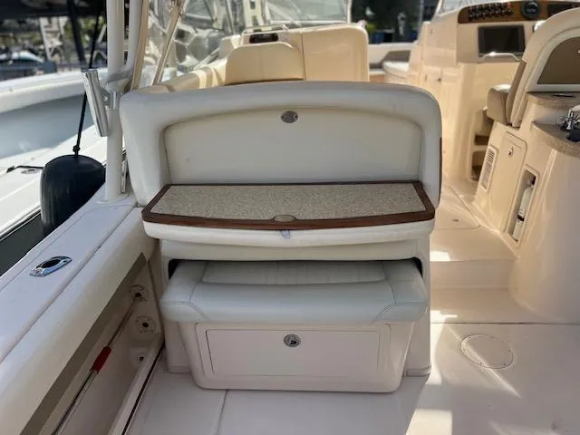 Slide: The Image of 2013 Grady-White Freedom 335 boat interior with seating and storage compartments. - 43