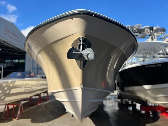 Slide: The Image of 2013 Grady-White Freedom 335 boat in a marina, front view. - 49