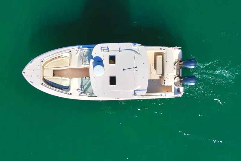 Slide: The Image of Aerial view of 2013 Grady-White Freedom 335 boat on clear green water. - 6