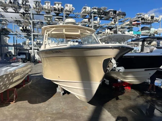 Slide: The Image of 2013 Grady-White Freedom 335 boat in storage facility, surrounded by other vessels. - 9