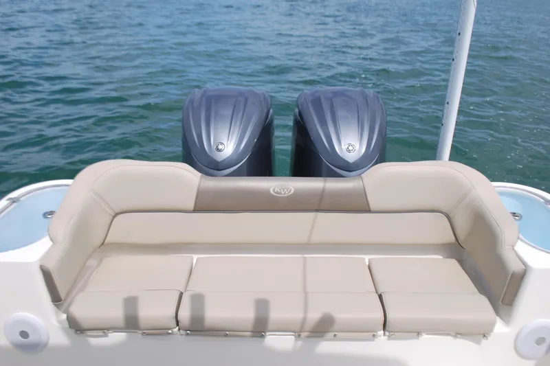 Slide: The Image of 2022 Key West 263 FS boat with dual engines and comfortable seating on the water. - 17