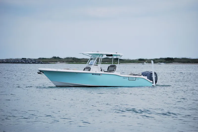 Slide: The Image of 2022 Key West 263 FS boat on calm water, overcast sky. - 5
