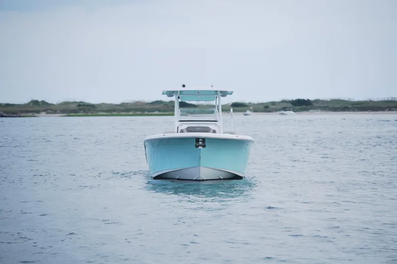 Slide: The Image of 2022 Key West 263 FS boat on calm water, distant shoreline in background. - 6