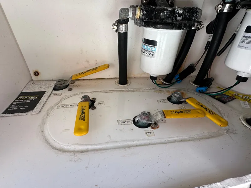 Slide: The Image of Engine compartment of a 2006 Island Runner 35 boat, featuring fuel system components. - 27