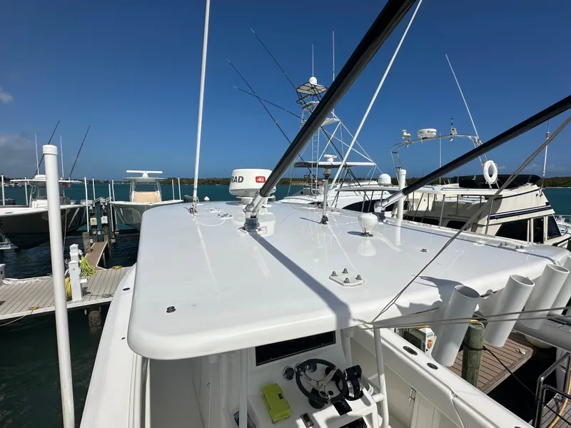 Slide: The Image of 2006 Island Runner 35 boat docked at marina under clear blue sky. - 29