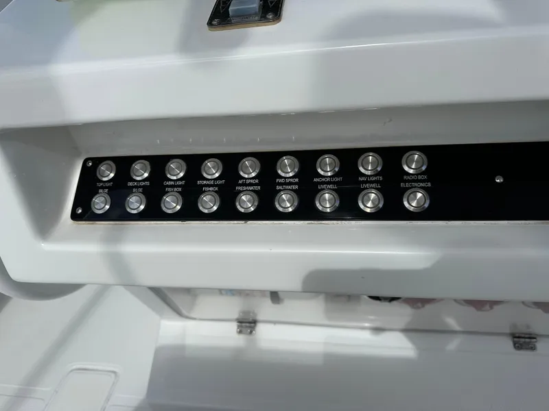 Slide: The Image of Control panel of a 2006 Island Runner 35 boat with labeled buttons. - 5