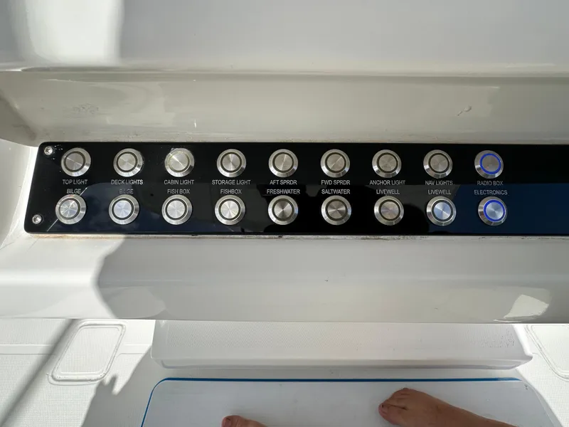 Slide: The Image of Control panel on a 2006 Island Runner 35 boat with labeled buttons. - 6