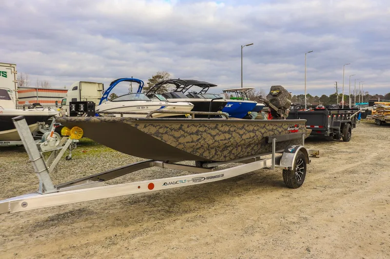 Slide: The Image of 2026 Gator Tail 17/50 MID-DECK SAVAGE SERIES boat on trailer in outdoor lot. - 0