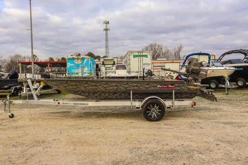 Slide: The Image of 2026 Gator Tail 17/50 Mid-Deck Savage Series boat on trailer, outdoor display. - 1