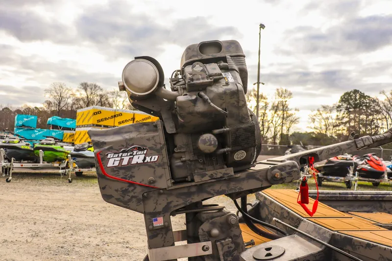 Slide: The Image of 2026 Gator Tail 17/50 MID-DECK SAVAGE SERIES boat engine, outdoor display with trailers. - 13