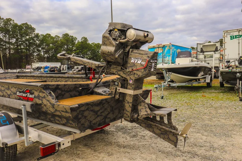 Slide: The Image of 2026 Gator Tail 17/50 MID-DECK SAVAGE SERIES boat with camo design in a lot. - 14