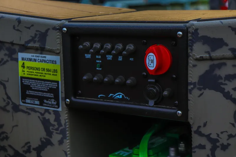 Slide: The Image of Control panel of 2026 Gator Tail 17/50 MID-DECK SAVAGE SERIES boat with capacity label. - 16