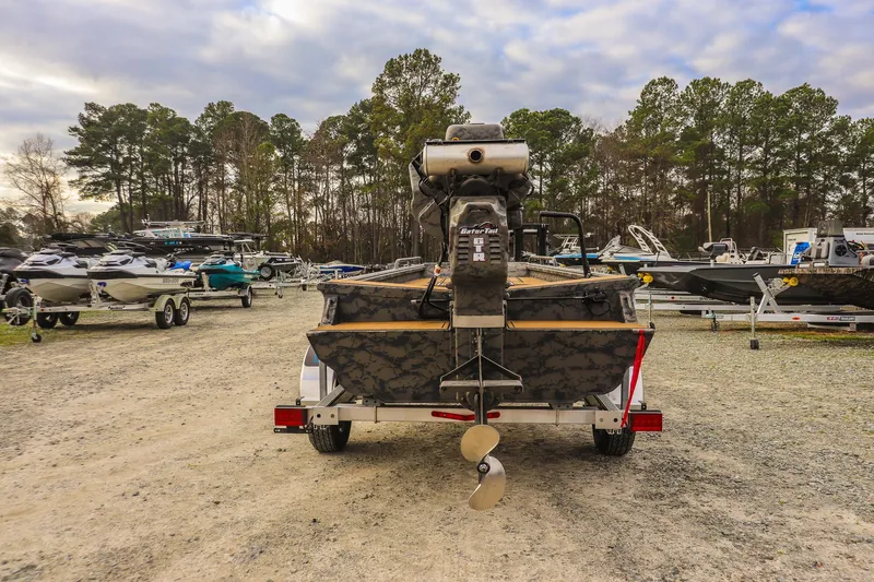 Slide: The Image of 2026 Gator Tail 17/50 MID-DECK SAVAGE SERIES boat on trailer in outdoor lot. - 3