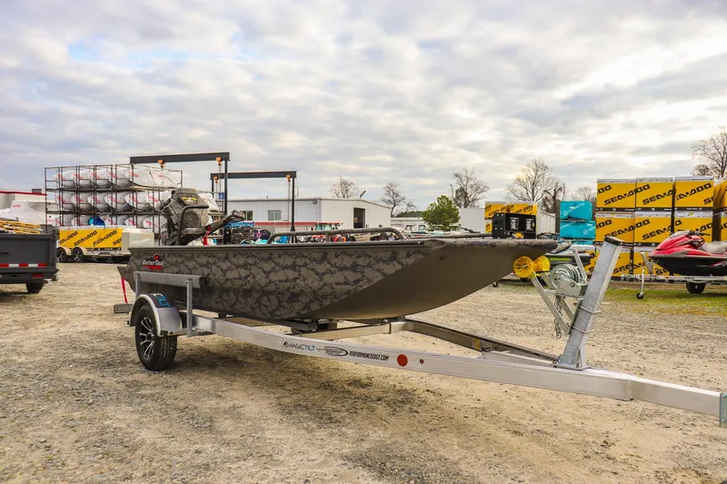 Slide: The Image of 2026 Gator Tail 17/50 MID-DECK SAVAGE SERIES boat on trailer, outdoor display. - 6