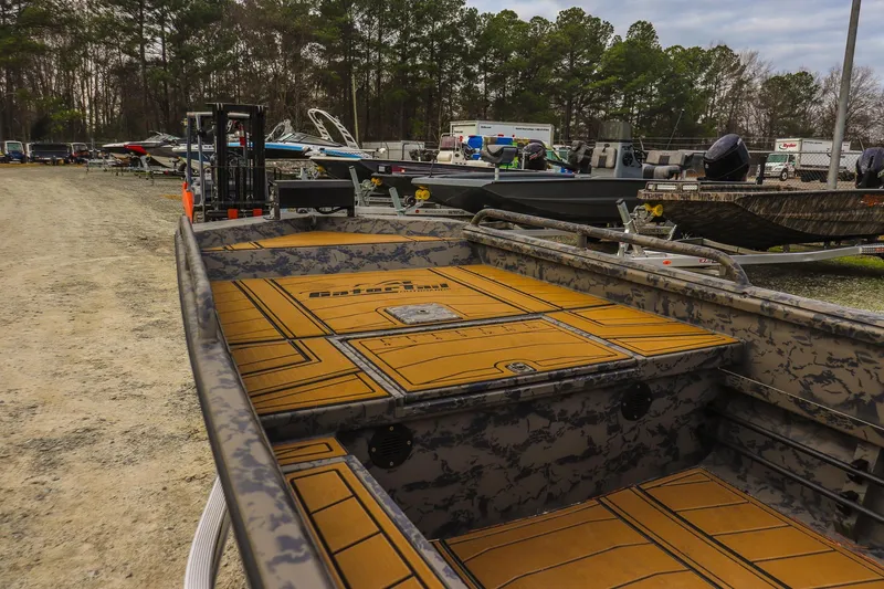 Slide: The Image of 2026 Gator Tail 17/50 MID-DECK SAVAGE SERIES boat in a lot with other boats. - 9