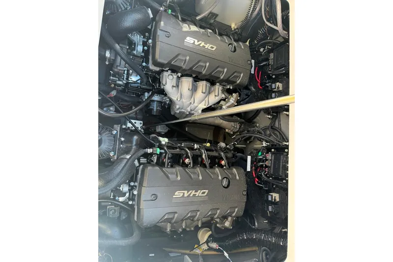 Slide: The Image of 2023 Yamaha Boats 255 FSH Sport E engine compartment with dual SVHO engines. - 3