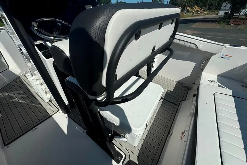 Slide: The Image of 2023 Yamaha Boats 255 FSH Sport E interior with seating and storage area. - 6