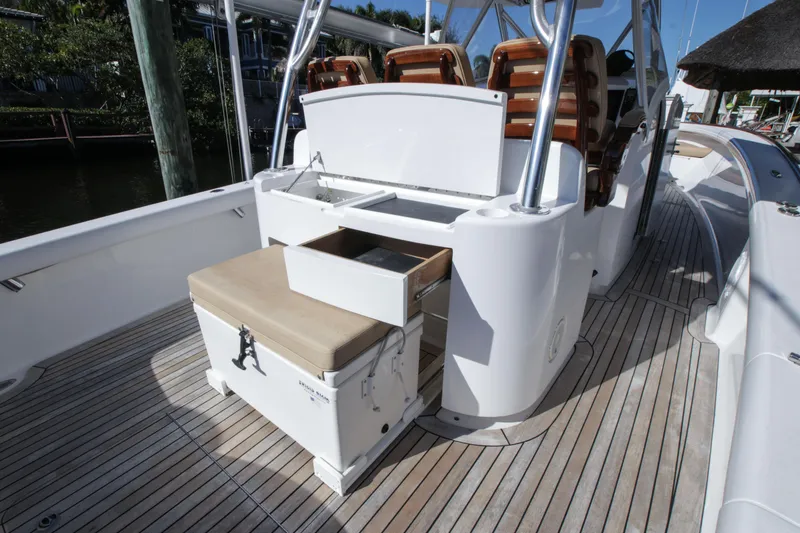 Slide: The Image of 2018 Winter Custom Yachts Center Console with open storage on deck. - 14