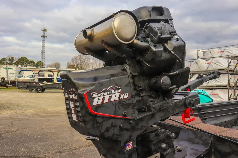 Slide: The Image of 2026 Gator Tail 1860 Extreme series boat engine in an outdoor setting. - 12