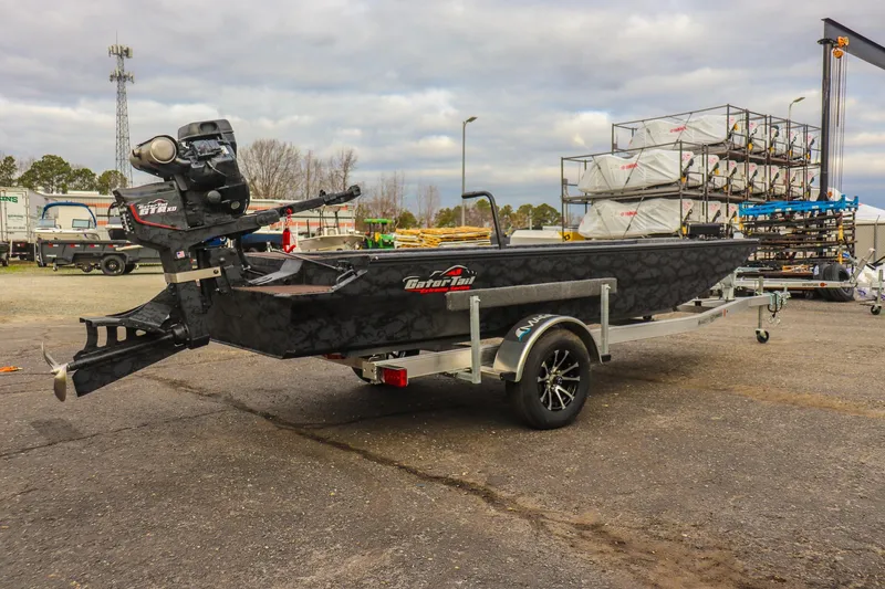 Slide: The Image of 2026 Gator Tail 1860 Extreme series boat on trailer, outdoor setting. - 2