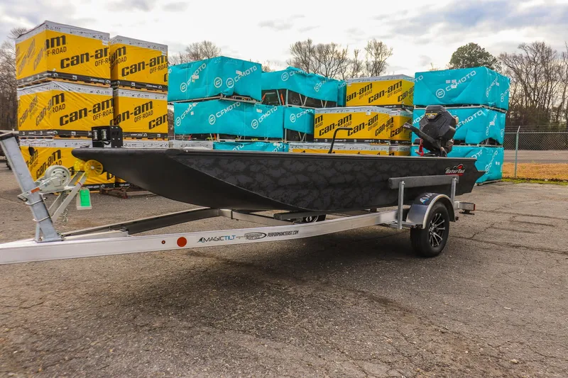 Slide: The Image of 2026 Gator Tail 1860 Extreme series boat on trailer, parked near Can-Am and CFMOTO boxes. - 6