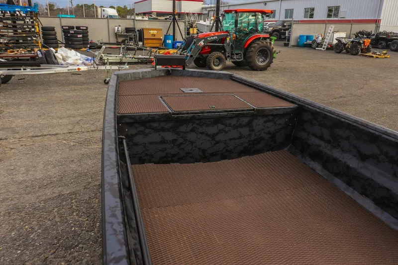 Slide: The Image of 2026 Gator Tail 1860 Extreme series boat in industrial yard setting. - 9