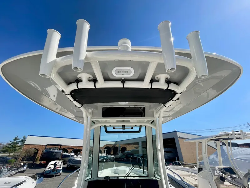 Slide: The Image of Boston Whaler 280 Dauntless 2026 with rod holders and sunshade. - 2