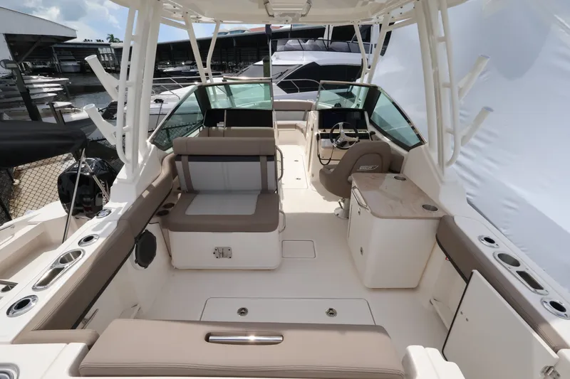 Slide: The Image of The image shows the cockpit of a 2026 Boston Whaler 240 Vantage with seating and helm. - 5