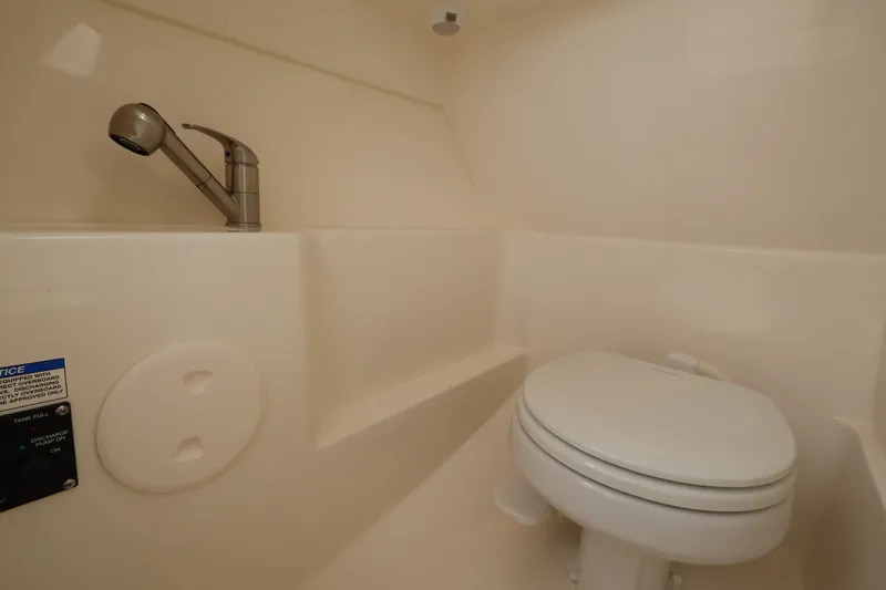 Slide: The Image of Interior with a toilet and faucet inside a boat. - 22
