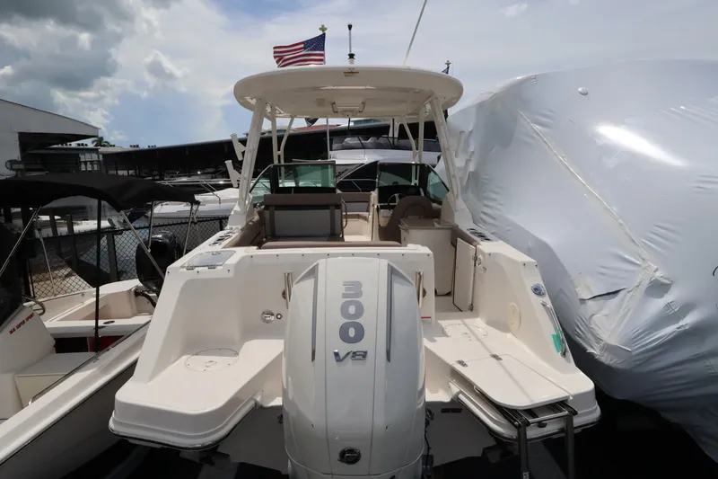 Slide: The Image of The image shows a Boston Whaler 240 Vantage boat with a 300 HP V8 engine. - 3