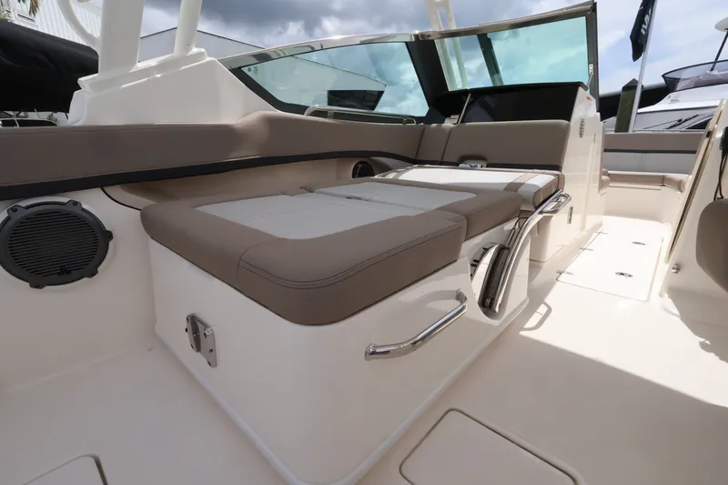 Slide: The Image of Interior of the 2026 Boston Whaler 240 Vantage with comfortable seating and modern design. - 11