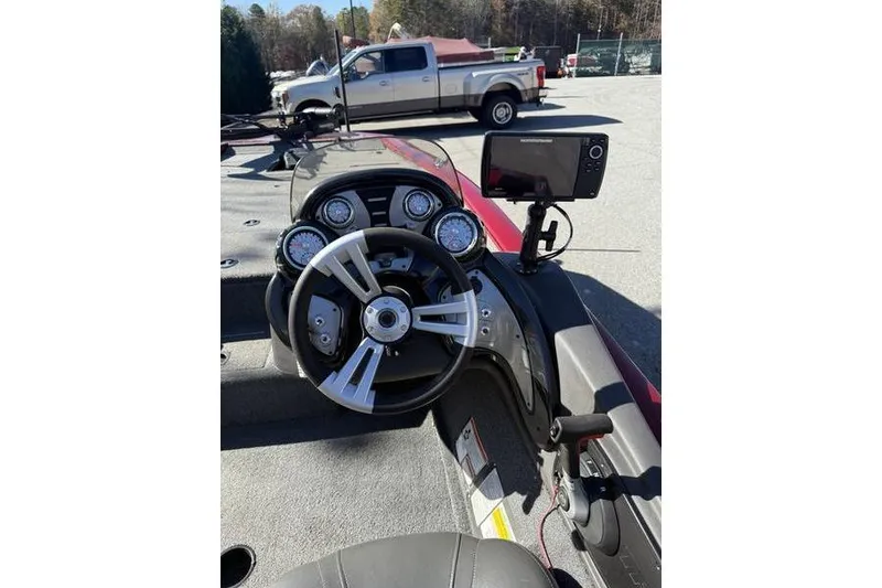 Slide: The Image of 2020 Tracker Pro Team 195 TXW boat dashboard with steering wheel and electronic display. - 4