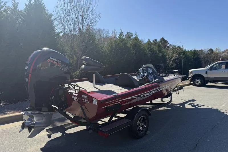 Slide: The Image of 2020 Tracker Pro Team 195 TXW boat on trailer, parked outdoors. - 7