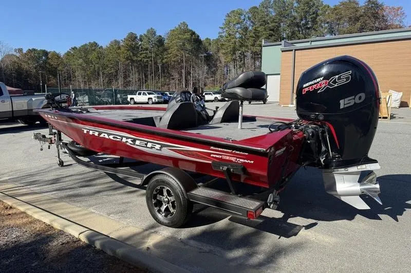 Slide: The Image of 2020 Tracker Pro Team 195 TXW boat with Mercury 150 engine, parked outdoors. - 8