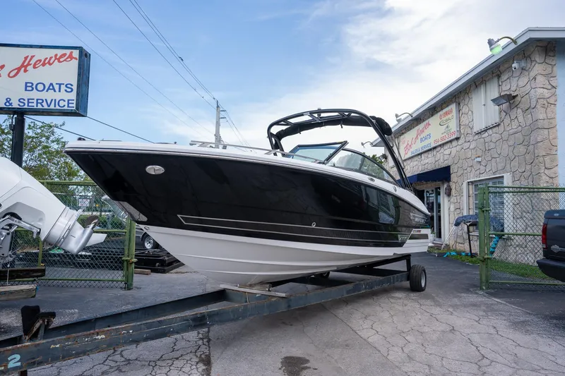 The Image of 2024 Monterey 235SS Super Sport boat on trailer at dealership. - 0