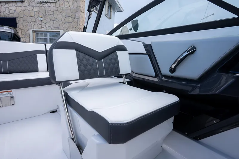 Slide: The Image of 2024 Monterey 235SS Super Sport boat interior with sleek seating and modern design. - 11