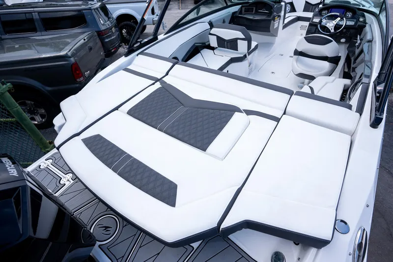Slide: The Image of 2024 Monterey 235SS Super Sport boat interior with sleek white and black seating. - 14