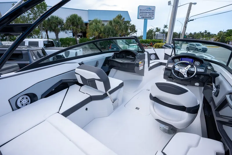 Slide: The Image of 2024 Monterey 235SS Super Sport boat interior with modern seating and dashboard. - 4