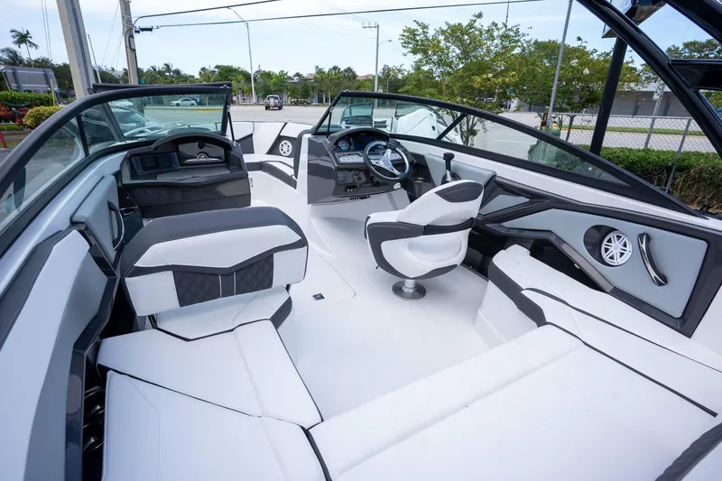 Slide: The Image of 2024 Monterey 235SS Super Sport boat interior with sleek seating and modern dashboard design. - 5