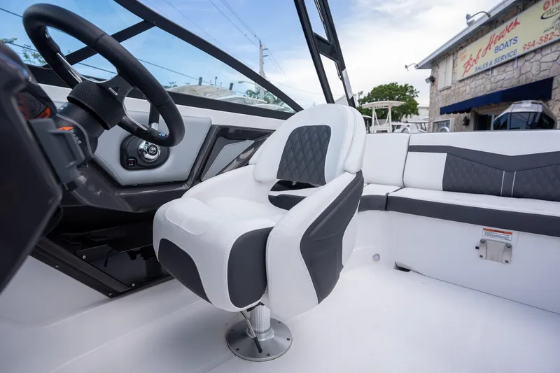Slide: The Image of 2024 Monterey 235SS Super Sport boat interior with modern seating and steering wheel. - 8